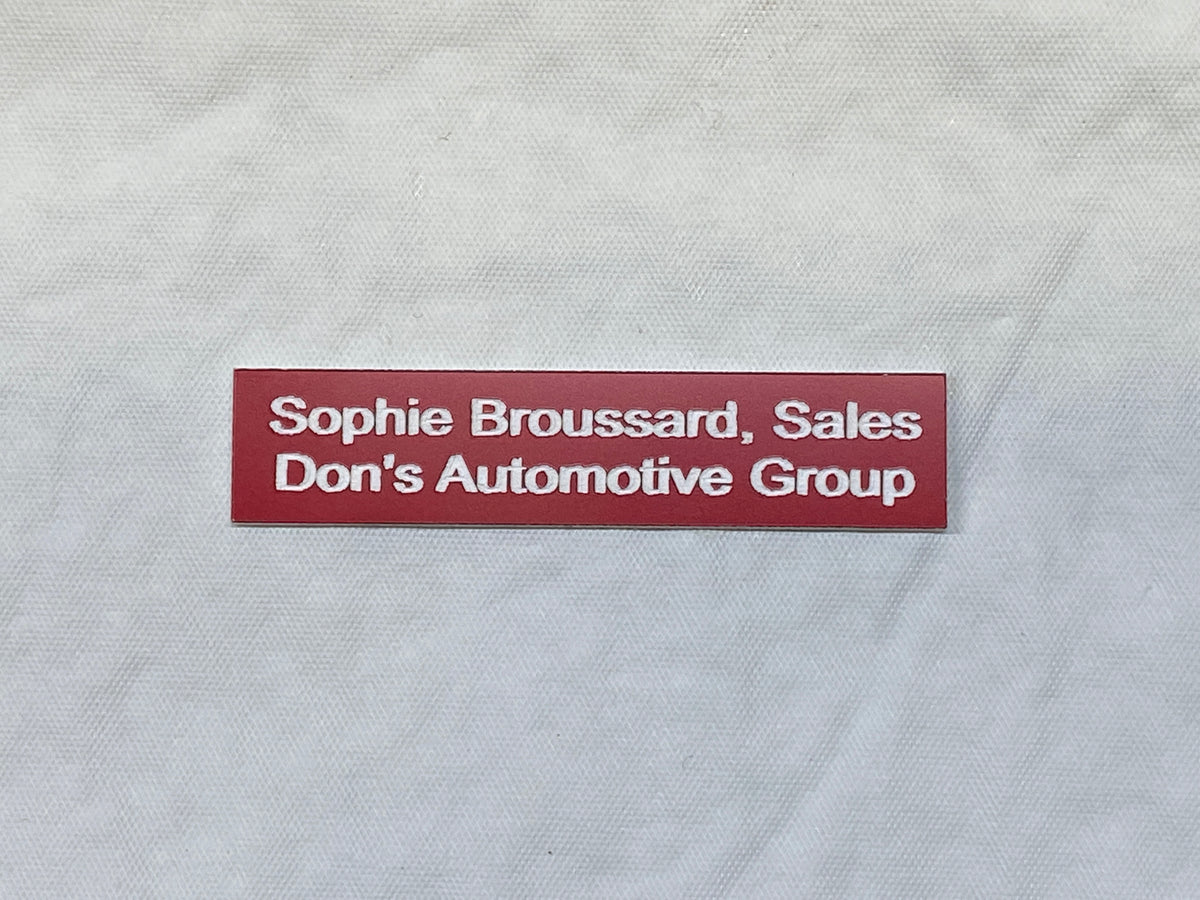 Red Name tag Laser Engraved to expose bright white text underneath.